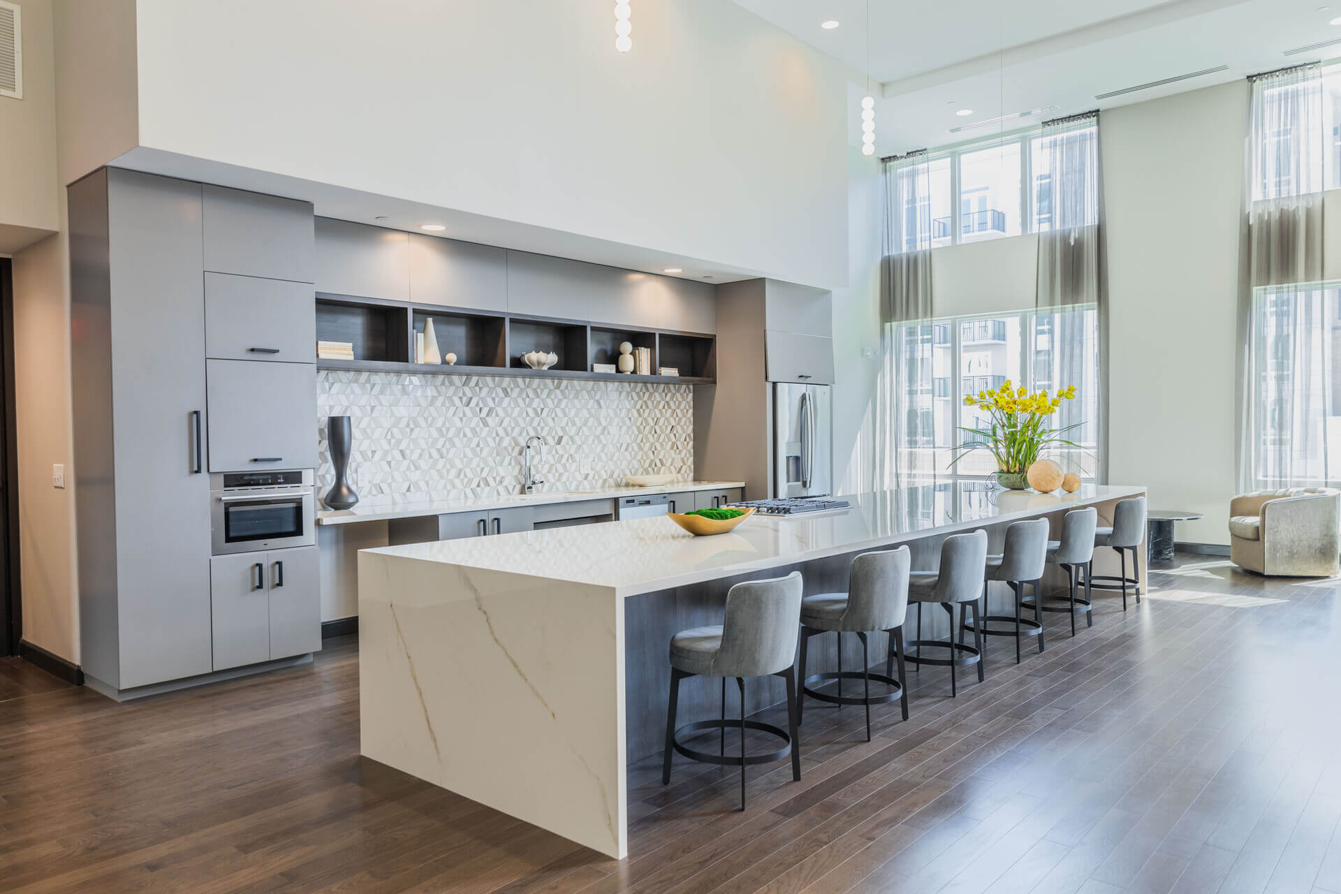 Spacious Lounge Area With White Countertop Kitchenette