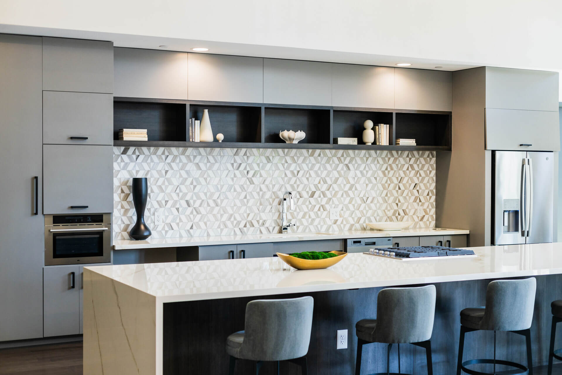 Spacious Lounge Area With White Countertop Kitchenette