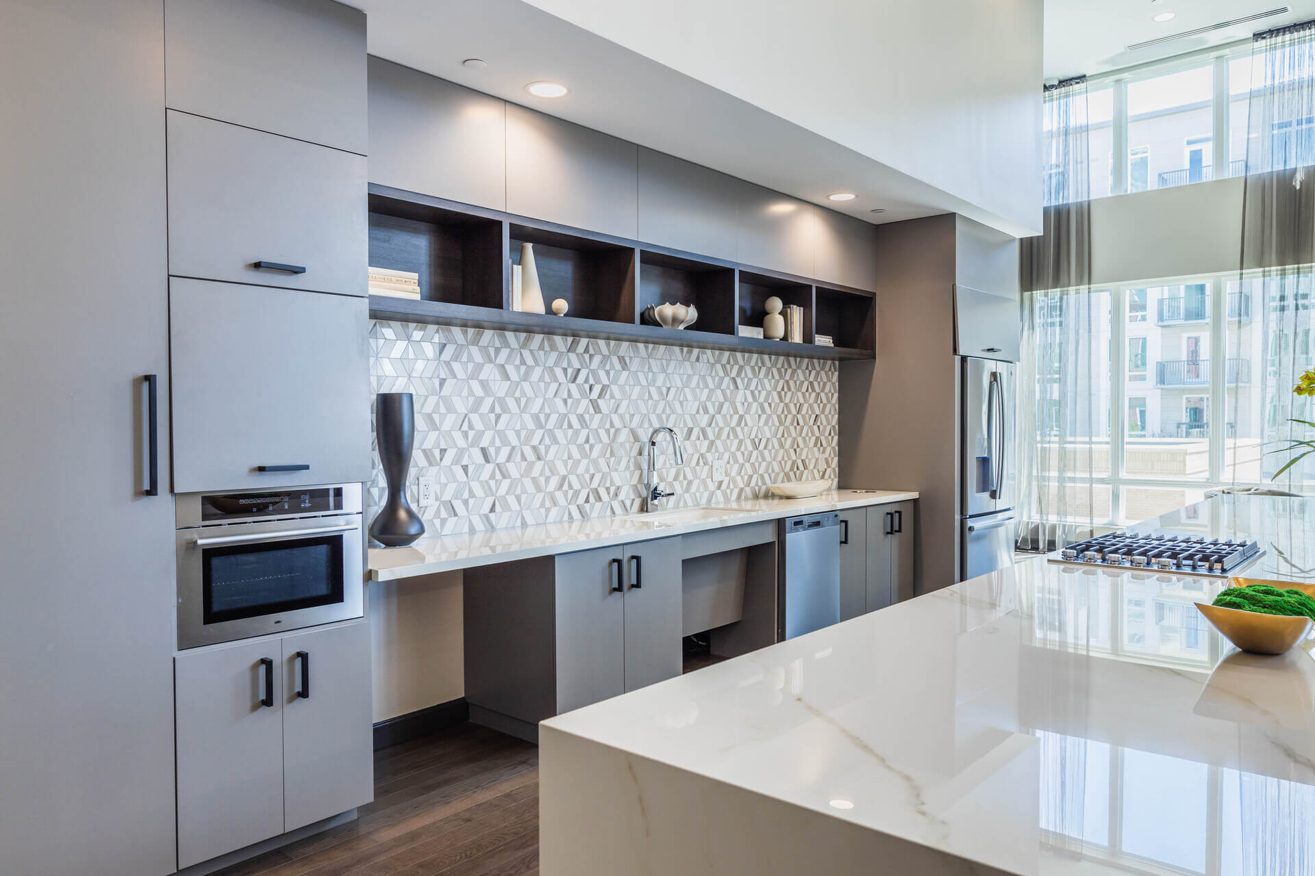 Spacious Lounge Area With White Countertop Kitchenette