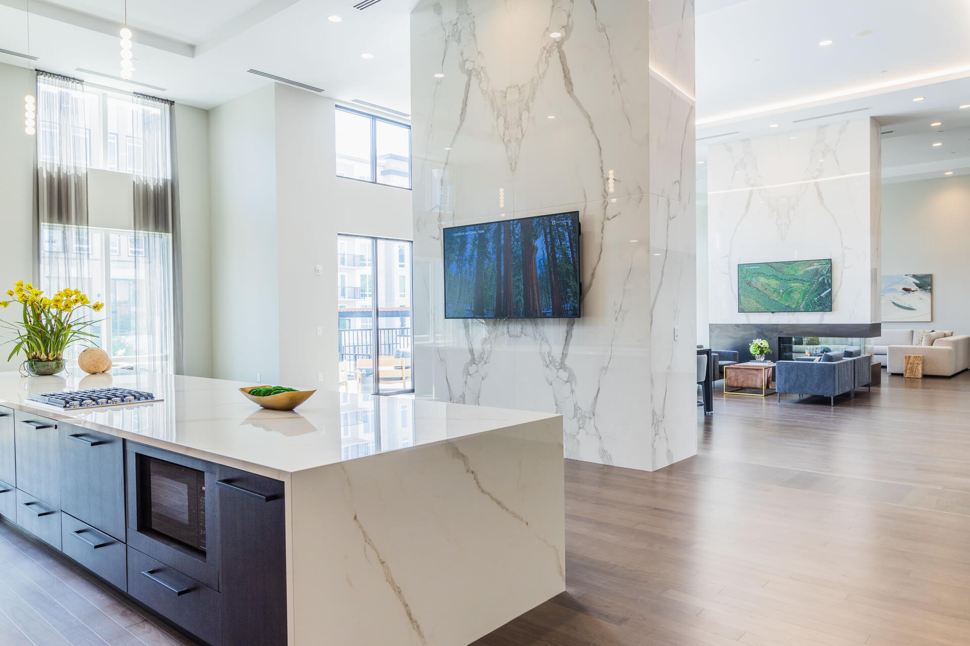 Spacious Lounge Area With White Countertop Kitchenette
